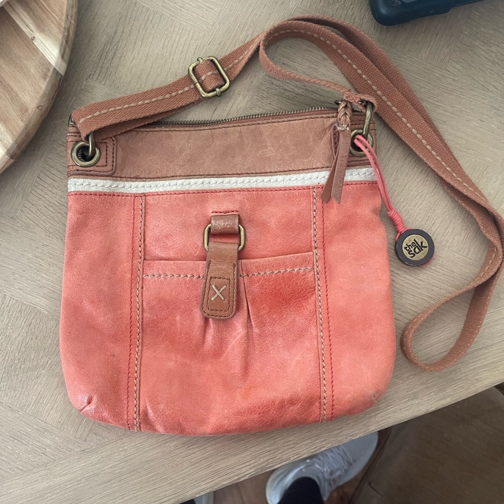 The SAK salmon color purse